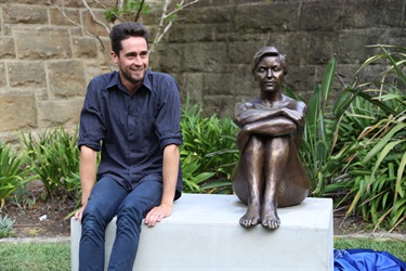 Artist Sam Harrison with his sculpture Seated Woman II