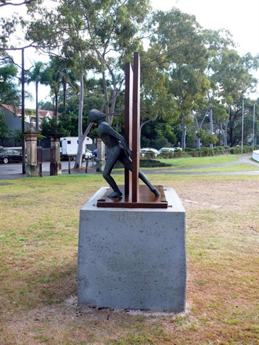 Guy Buseyne, The Wall. Trumper Park, Paddington. The former graphic artist Guy Buseyne studied the craft of furniture making before exploring the plastic and ceramic arts. The Wall is an elegant and expressive figurative work made of Corten steel.