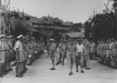 Admiral Sir Bruce Fraser, GCB, KBE, RN, inspects men of the 2nd Minesweeping Flotilla in Watsons Bay, Sydney, 20 November 1944. [The wharf at the Vaucluse Amateur 12ft Sailing Club, Wharf Road, was extended during WWII]. Image: Naval History Section, Sea Power Centre - Australia.