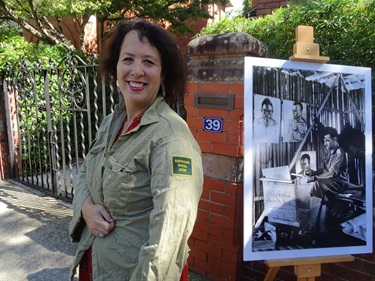 Guest speaker, artist Wendy Sharpe displaying a shirt worn during her time as an Australian Official Artist attached to the Australian Army History Unit in Dili, East Timor in 1999