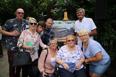 Relatives of Jeffery Freeman with his portrait