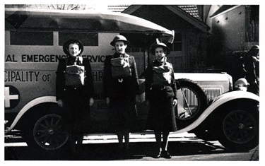 National Emergency Service vehicle with 3 female volunteers during World War 2