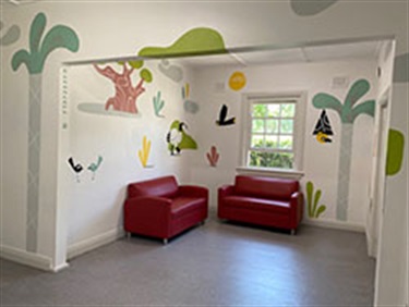 Image of mural done by Artist Ignacio Querejeta at Rose Bay Cottage. He has painted a fun and colourful mural, Bush Friends, depicting a range of native flora and fauna.