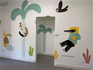 Image of mural done by Artist Ignacio Querejeta at Rose Bay Cottage. He has painted a fun and colourful mural, Bush Friends, depicting a range of native flora and fauna.