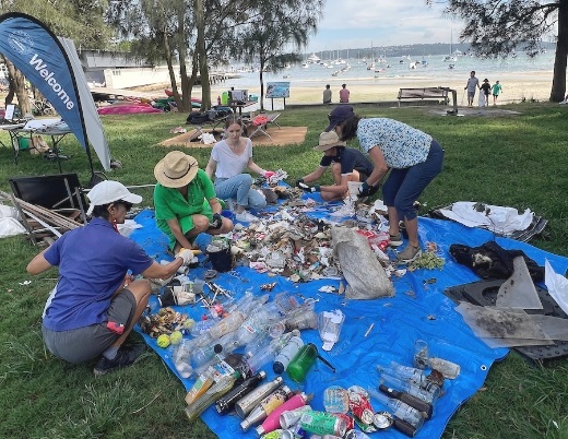 People sorting litter from beach clean up