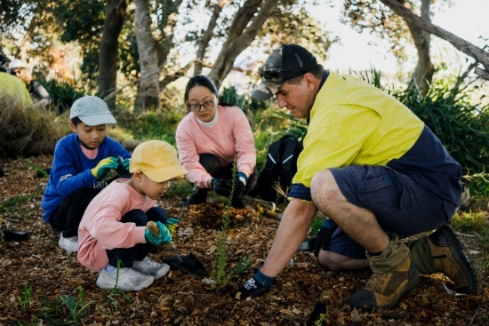 tree planting family and worker