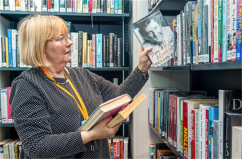 Librarian shelving books at Woollahra Libraries 