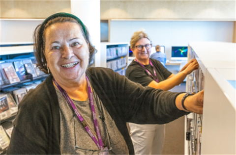 Volunteers shelve books at Woollahra Libraries
