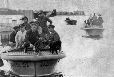 Released Eighth Division men coming ashore by barge from the Catalinas at Rose Bay