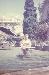 Belle Miller seated in Blackburn Gardens