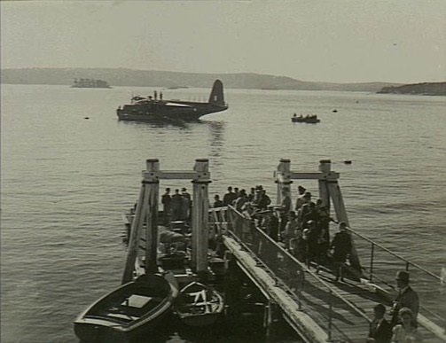 A group of civilians on the wharf at the flying boat base at Rose Bay
