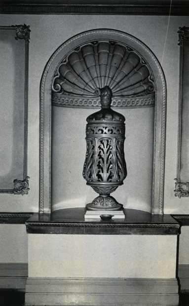 Ceramic urn set in a wall alcove