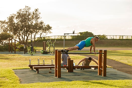 People exercising at the Christison Park outdoor gym