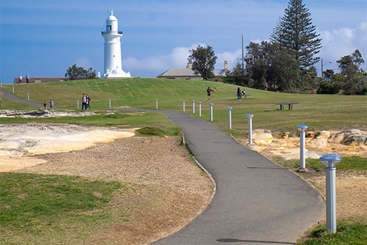 Footpath through park with Macquarie Lighthouse in Background