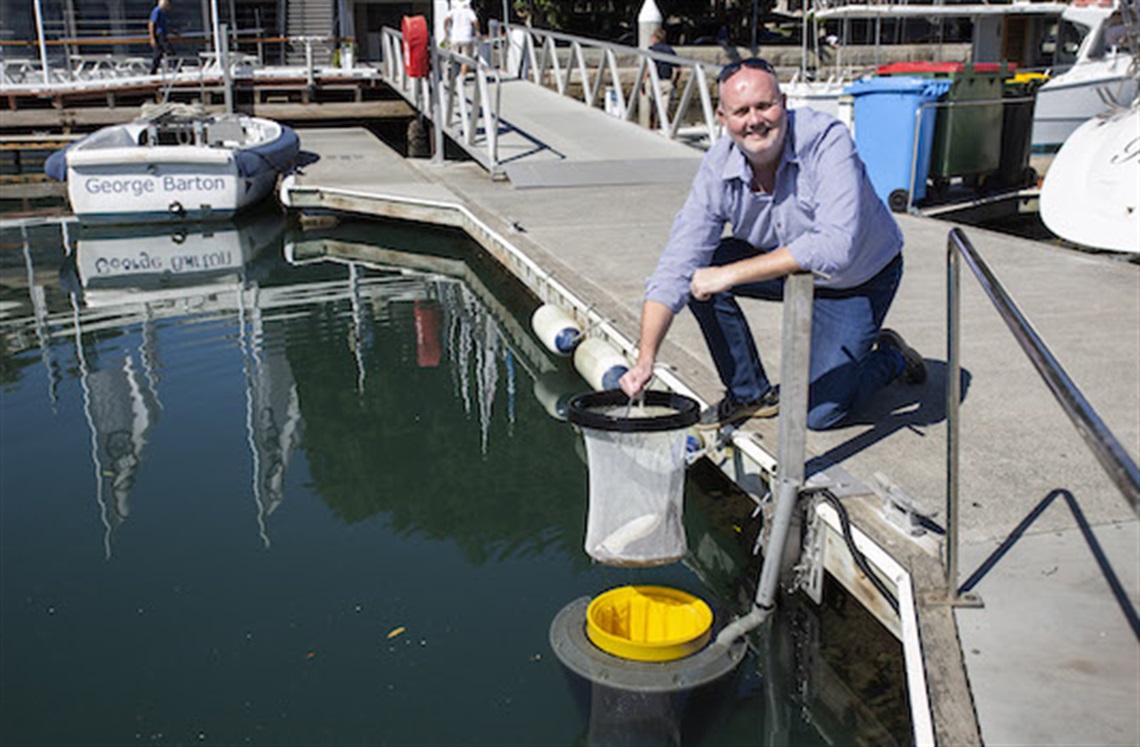 CYCA Commodore Paul Billingham with the newly installed SeaBins at Rushcutters Bay