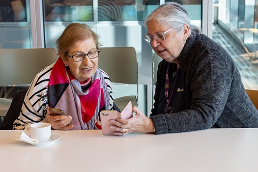 Eda Lee with volunteer at the library