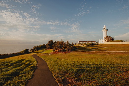 Macquarie Lighthouse with a walking path stretching in front