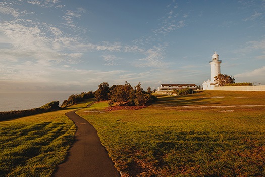 Macquarie Lighthouse with a walking path stretching in front