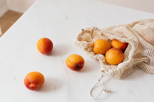 Mandarins in a reusable produce bag