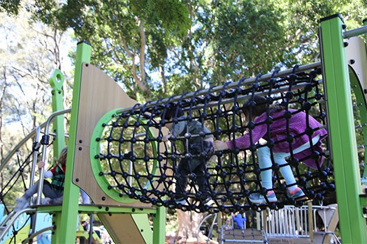Children climbing through net